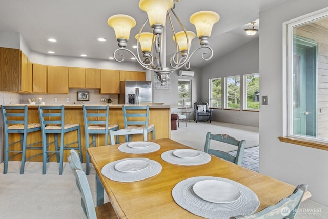 575 Kahkwo Ct SE, Ocean Shores, WA 98569 - dining area with light carpet, a chandelier, a wall mounted AC, recessed lighting, and vaulted ceiling