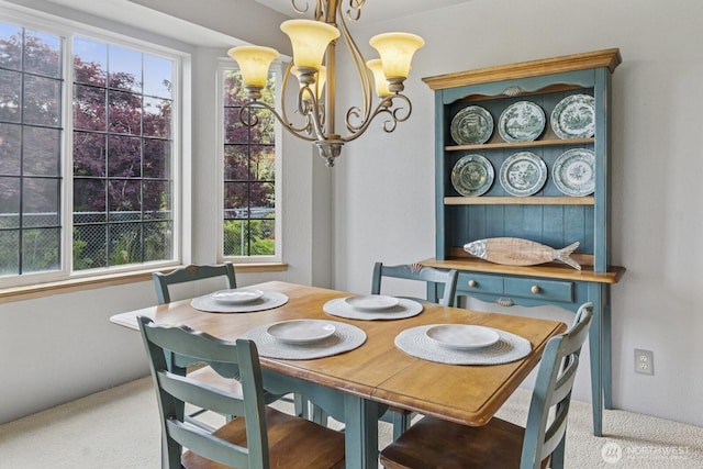 575 Kahkwo Ct SE, Ocean Shores, WA 98569 - carpeted dining room featuring a chandelier