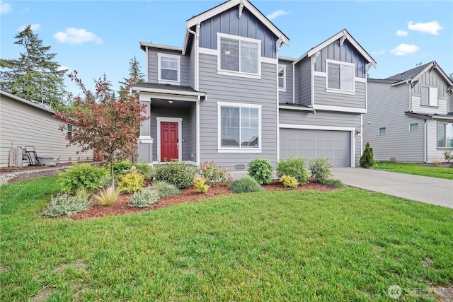 1194 Panoramic Loop, Bremerton, WA 98312 - view of front of house featuring board and batten siding, an attached garage, concrete driveway, and a front lawn