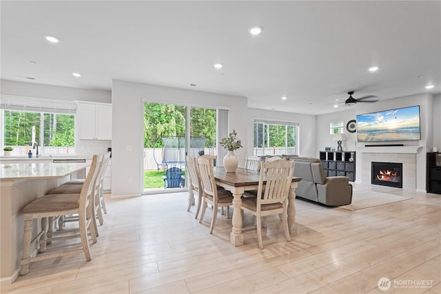 1194 Panoramic Loop, Bremerton, WA 98312 - dining room with recessed lighting, a tiled fireplace, light wood finished floors, and ceiling fan