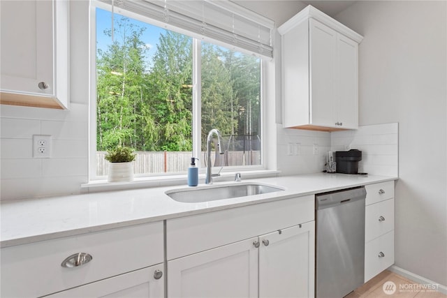 1194 Panoramic Loop, Bremerton, WA 98312 - kitchen with stainless steel dishwasher, a sink, decorative backsplash, white cabinets, and plenty of natural light