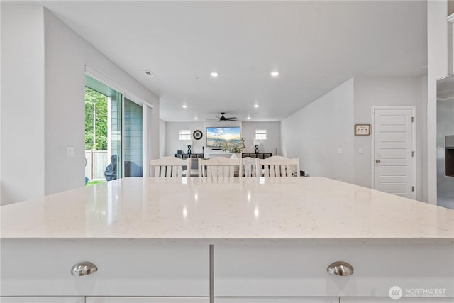 1194 Panoramic Loop, Bremerton, WA 98312 - kitchen featuring a center island, ceiling fan, recessed lighting, and light stone counters