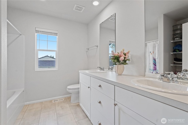1194 Panoramic Loop, Bremerton, WA 98312 - bathroom with double vanity, toilet, recessed lighting, baseboards, and shower / bath combo with shower curtain