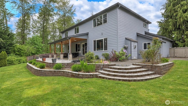 rear view of house with a patio