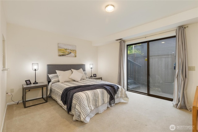 carpeted bedroom featuring access to outside