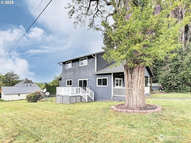 823 D St, Vader, WA 98593 - rear view of house featuring a yard and a wooden deck