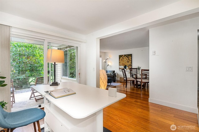 office area featuring wood finished floors and baseboards