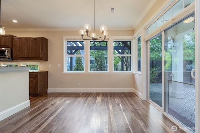 711 SE Pheasant Run, College Place, WA 99324 - unfurnished dining area with light wood-style floors, crown molding, a chandelier, and baseboards