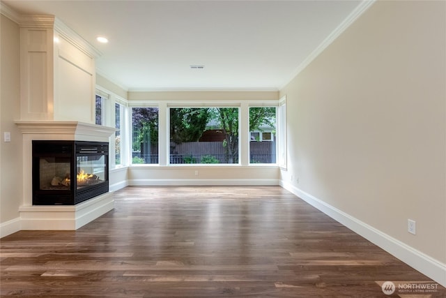 711 SE Pheasant Run, College Place, WA 99324 - unfurnished living room with ornamental molding, wood finished floors, a multi sided fireplace, baseboards, and recessed lighting