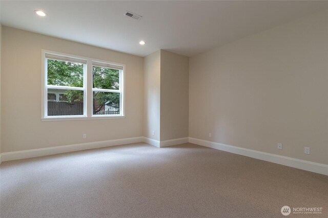 711 SE Pheasant Run, College Place, WA 99324 - spare room featuring baseboards, light colored carpet, and recessed lighting