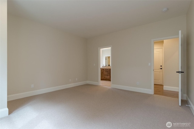 711 SE Pheasant Run, College Place, WA 99324 - unfurnished bedroom featuring light carpet, baseboards, and ensuite bath