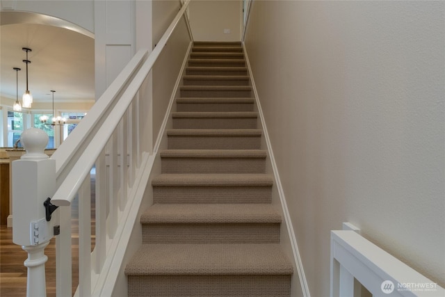 711 SE Pheasant Run, College Place, WA 99324 - stairs featuring a chandelier and arched walkways