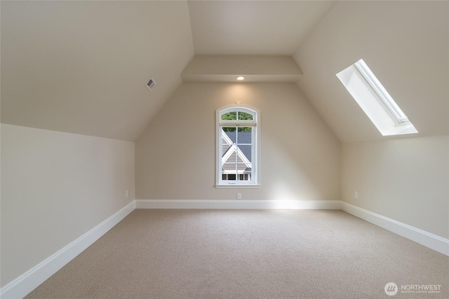 711 SE Pheasant Run, College Place, WA 99324 - additional living space featuring light carpet, a skylight, vaulted ceiling, and baseboards