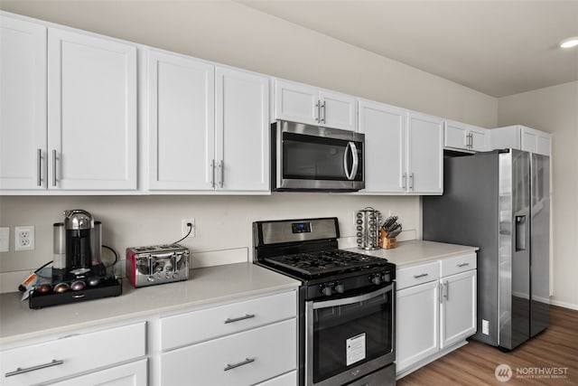 7810 22nd Trl SE, Lacey, WA 98503 - kitchen with stainless steel appliances, white cabinetry, and light countertops