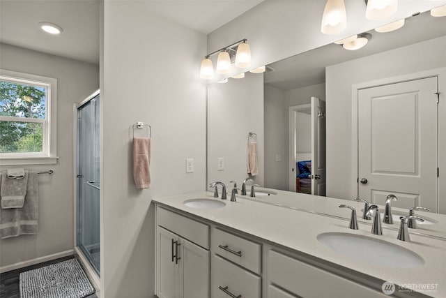 7810 22nd Trl SE, Lacey, WA 98503 - full bathroom with a shower stall, baseboards, and double vanity