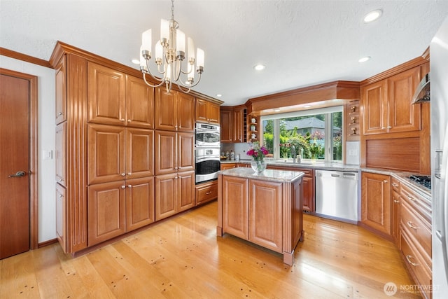 916 Kari Ln, Steilacoom, WA 98388 - kitchen featuring stainless steel appliances, brown cabinetry, light wood-type flooring, recessed lighting, and crown molding