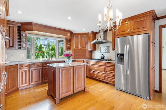 916 Kari Ln, Steilacoom, WA 98388 - kitchen with stainless steel fridge with ice dispenser, light wood-style flooring, a chandelier, gas stovetop, and recessed lighting