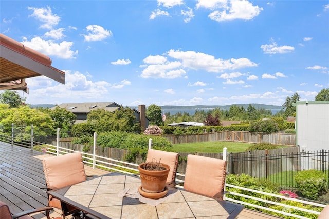 916 Kari Ln, Steilacoom, WA 98388 - fenced backyard with outdoor dining space and a wooden deck