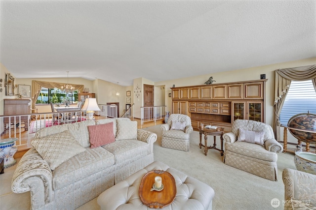 916 Kari Ln, Steilacoom, WA 98388 - living area with light carpet, lofted ceiling, a chandelier, and stairway