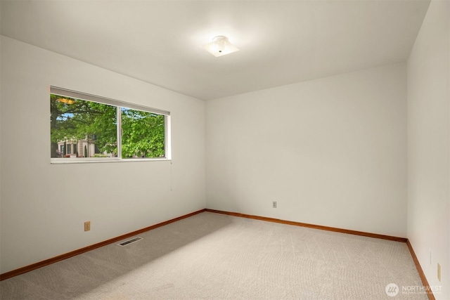 10215 126th Ave NE, Kirkland, WA 98033 - unfurnished room featuring light colored carpet and baseboards