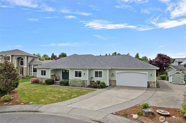 2557 Captains Ct, Ferndale, WA 98248 - view of front of home featuring stone siding, concrete driveway, an attached garage, a front lawn, and roof with shingles
