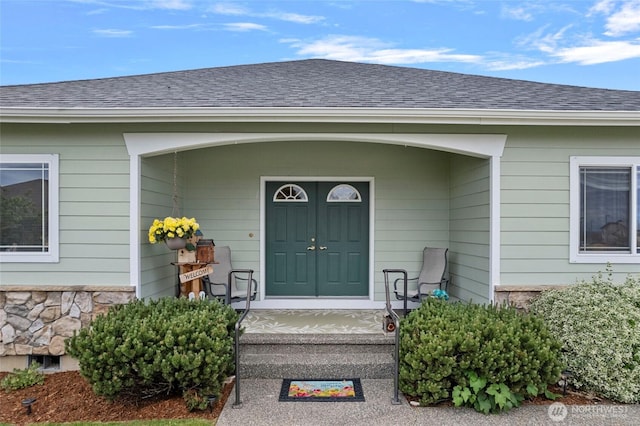 2557 Captains Ct, Ferndale, WA 98248 - doorway to property featuring roof with shingles and stone siding