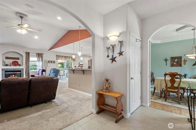 2557 Captains Ct, Ferndale, WA 98248 - living room with ceiling fan, lofted ceiling, arched walkways, light tile patterned flooring, and recessed lighting