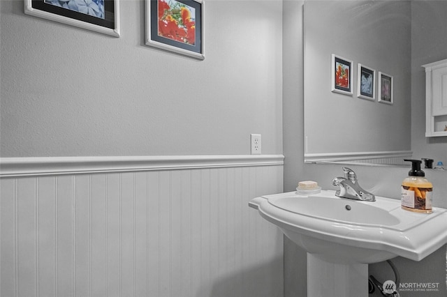 2557 Captains Ct, Ferndale, WA 98248 - bathroom featuring a wainscoted wall and a sink