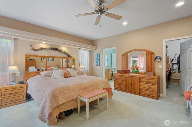 2557 Captains Ct, Ferndale, WA 98248 - bedroom featuring light colored carpet, multiple windows, recessed lighting, connected bathroom, and a ceiling fan