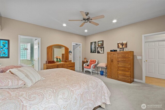 2557 Captains Ct, Ferndale, WA 98248 - bedroom featuring light carpet, recessed lighting, ceiling fan, ensuite bathroom, and baseboards