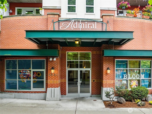 2331 42nd Ave SW Unit 403, Seattle, WA 98116 - entrance to property with brick siding and french doors