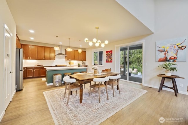 4471 Hales Ct SW, Port Orchard, WA 98367 - dining space with light wood-style floors, recessed lighting, baseboards, and a chandelier