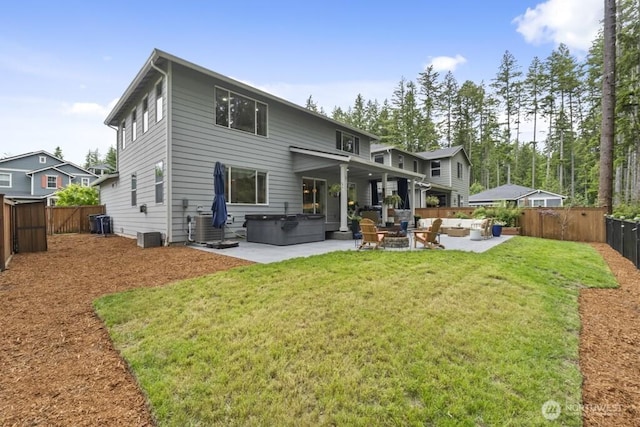 4471 Hales Ct SW, Port Orchard, WA 98367 - back of house featuring a hot tub, a patio area, outdoor lounge area, and central AC unit