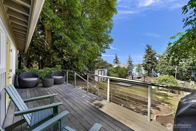 2920 Cedar Ave, Lummi Island, WA 98262 - wooden deck with a storage unit and a grill
