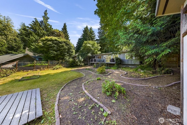 2920 Cedar Ave, Lummi Island, WA 98262 - view of grassy yard with a garden and a deck
