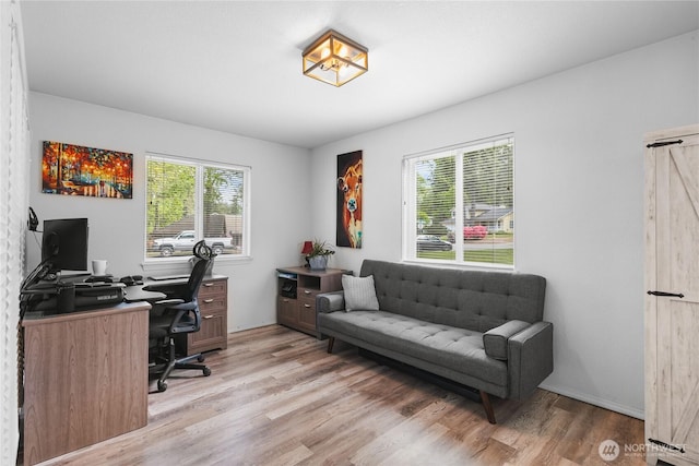 home office with light wood finished floors