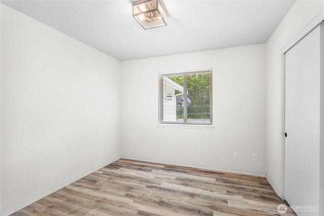 empty room with light wood-style flooring