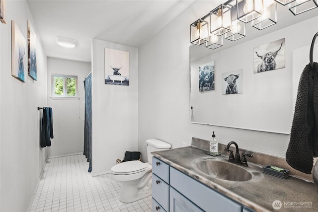 full bathroom featuring tile patterned floors, toilet, vanity, and curtained shower