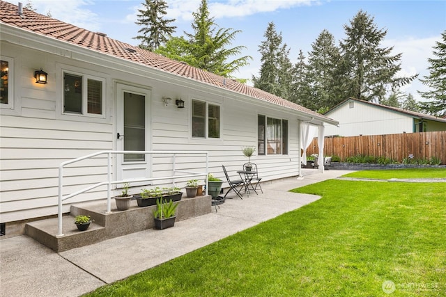 back of house with a patio