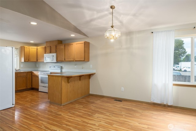 463 Rohrer Loop, Sedro Woolley, WA 98284 - kitchen featuring white appliances, light wood finished floors, a peninsula, a chandelier, and recessed lighting