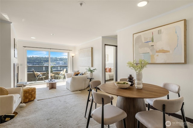 1504 Aurora Ave N Unit 407, Seattle, WA 98109 - carpeted dining area featuring ornamental molding, a water view, and recessed lighting