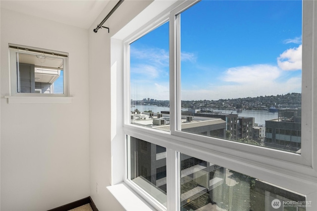 1504 Aurora Ave N Unit 407, Seattle, WA 98109 - sunroom / solarium with a water view and a view of city