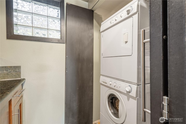 1504 Aurora Ave N Unit 407, Seattle, WA 98109 - laundry room featuring stacked washer and clothes dryer