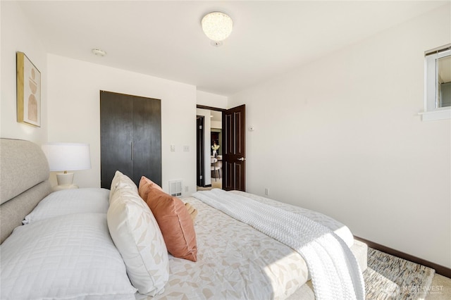 1504 Aurora Ave N Unit 407, Seattle, WA 98109 - carpeted bedroom with baseboards and a closet