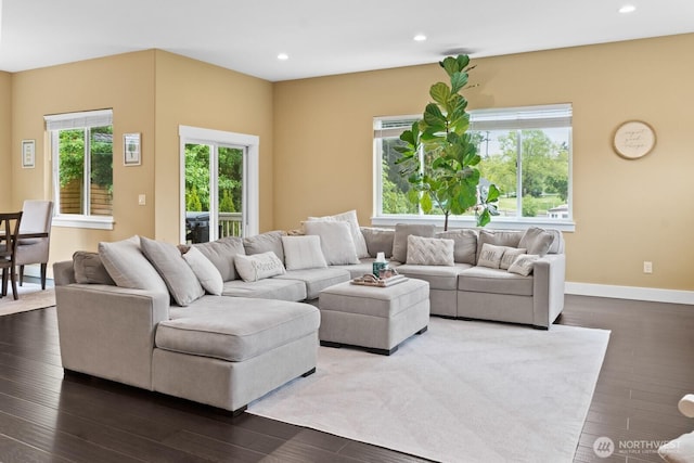 2311 S 135th Ln, Seattle, WA 98168 - living area with dark wood-style flooring, recessed lighting, and baseboards