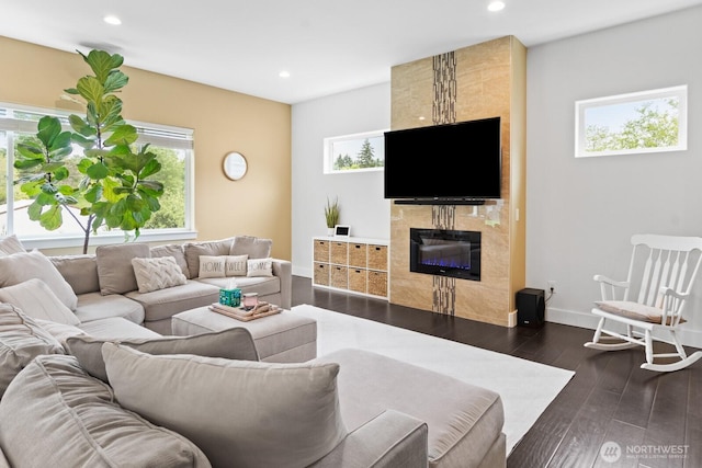 2311 S 135th Ln, Seattle, WA 98168 - living area featuring a high end fireplace, plenty of natural light, baseboards, recessed lighting, and dark wood finished floors