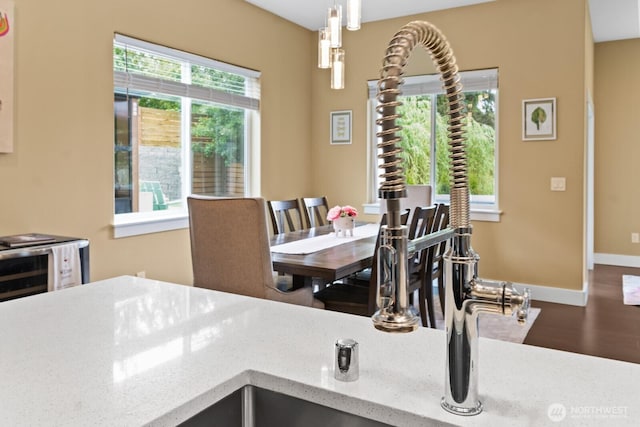 2311 S 135th Ln, Seattle, WA 98168 - dining area featuring wood finished floors and baseboards