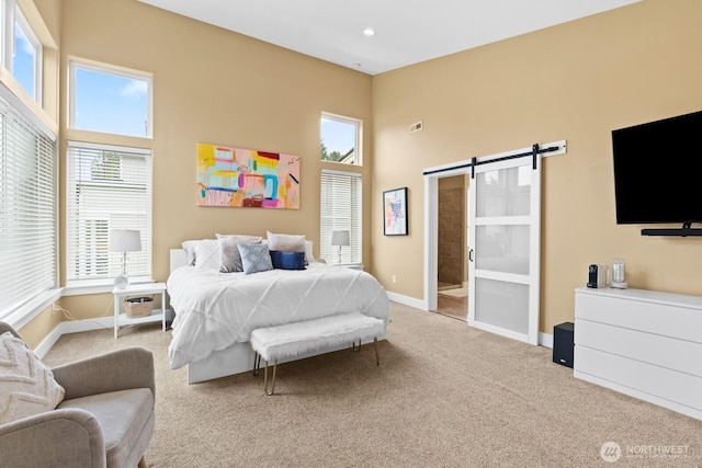 2311 S 135th Ln, Seattle, WA 98168 - carpeted bedroom featuring a barn door, baseboards, a high ceiling, and recessed lighting