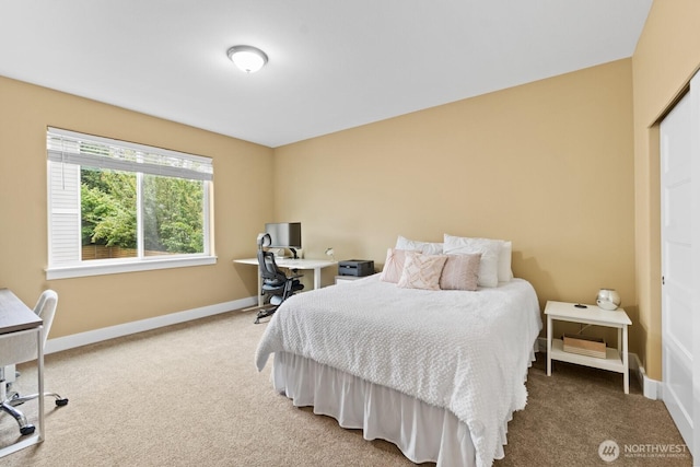 2311 S 135th Ln, Seattle, WA 98168 - bedroom with light colored carpet, an office area, and baseboards