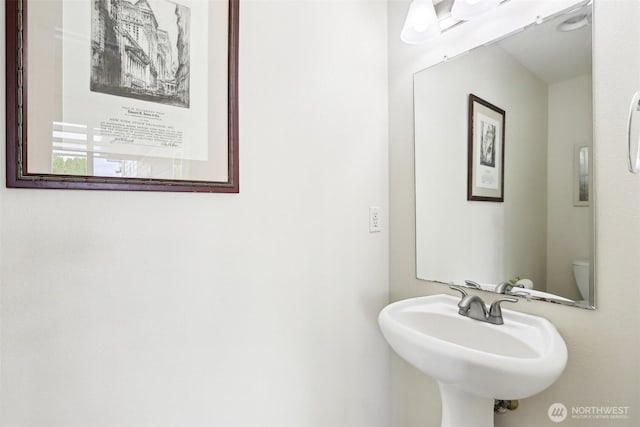 half bathroom with a sink